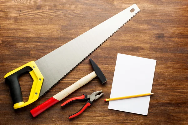 Joinery tools on wood table background with note book and copy space — Stock Photo, Image