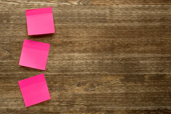 Memo note stick on wooden background — Stock Photo, Image