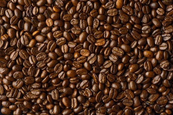 Roasted coffee beans, can be used as a background — Stock Photo, Image