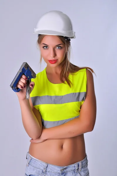 Сексуальна дівчина будівельник степлер — стокове фото