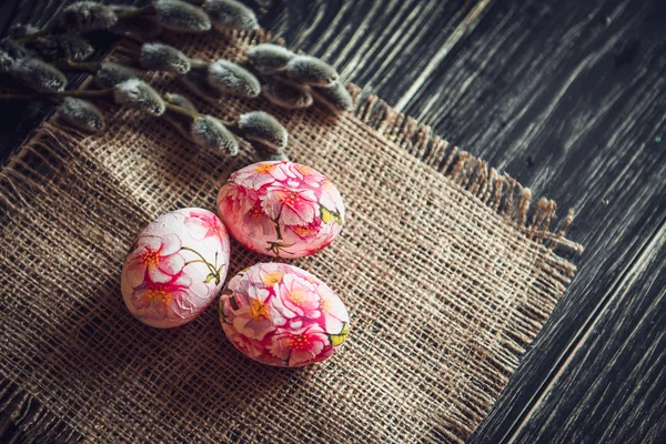 Easter eggs with pussy willow on light background — Stock Photo, Image