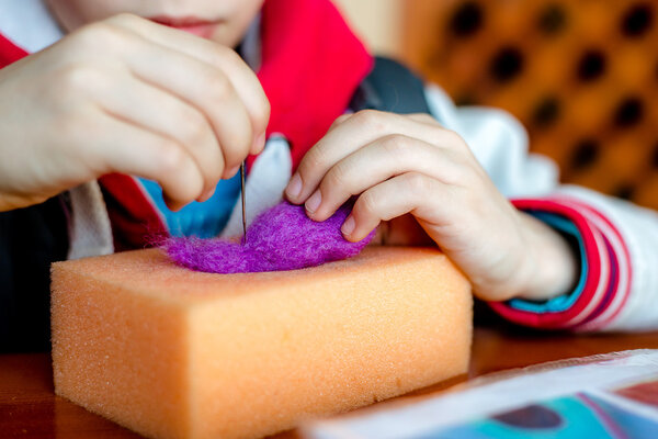 Manufacturing process from wool soft toys. Felting activity