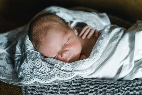 Sleeping newborn baby wrapped in a blanket — Stock Photo, Image