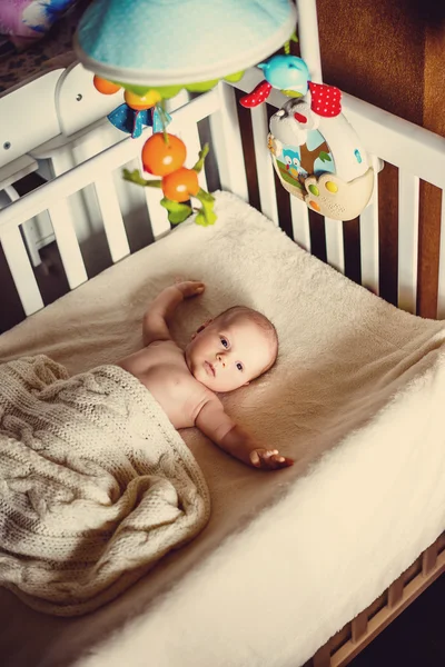 Two month old baby sound asleep in his crib — Stock Photo, Image