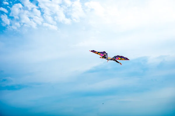 Kite flying against the blue sky — Stock Photo, Image