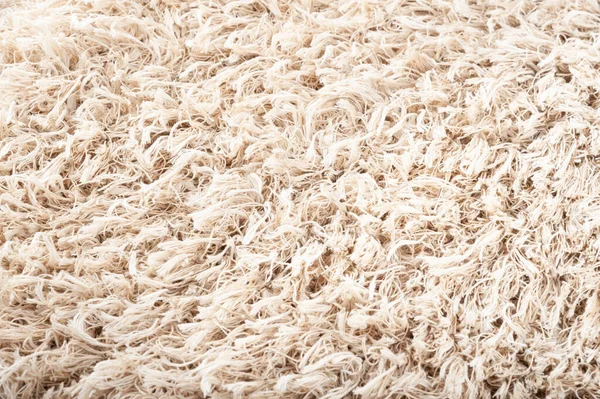 ベージュのカーペットの質感のクローズアップ 自然の毛皮の背景 テクスチャ 抽象パターン — ストック写真