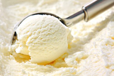 Vanilla ice cream scoop, scooped out of container with utensil clipart