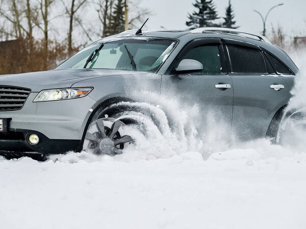 Moscow, Russia - January 24, 2019: Car infiniti QX70, winter photos of the car when driving through snowdrifts.