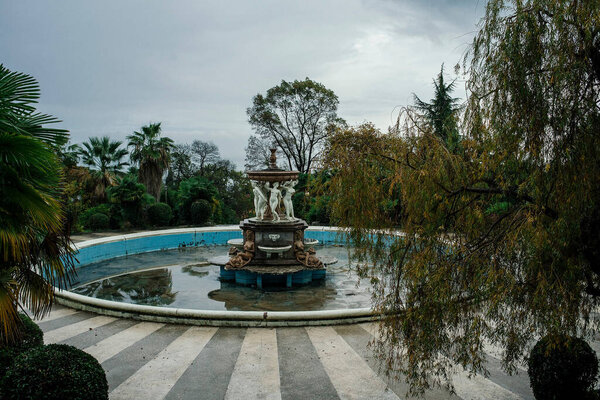 Fountain with statues near the ancient ancient palace. The manor of the master.