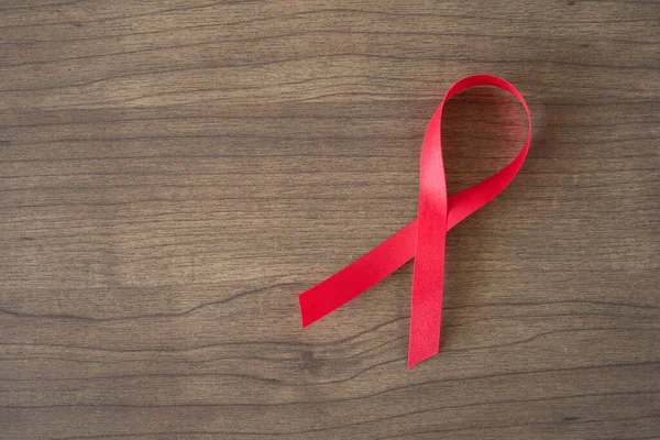 World Aids Day Concept Red Ribbon Wooden Table Background — Stock Photo, Image