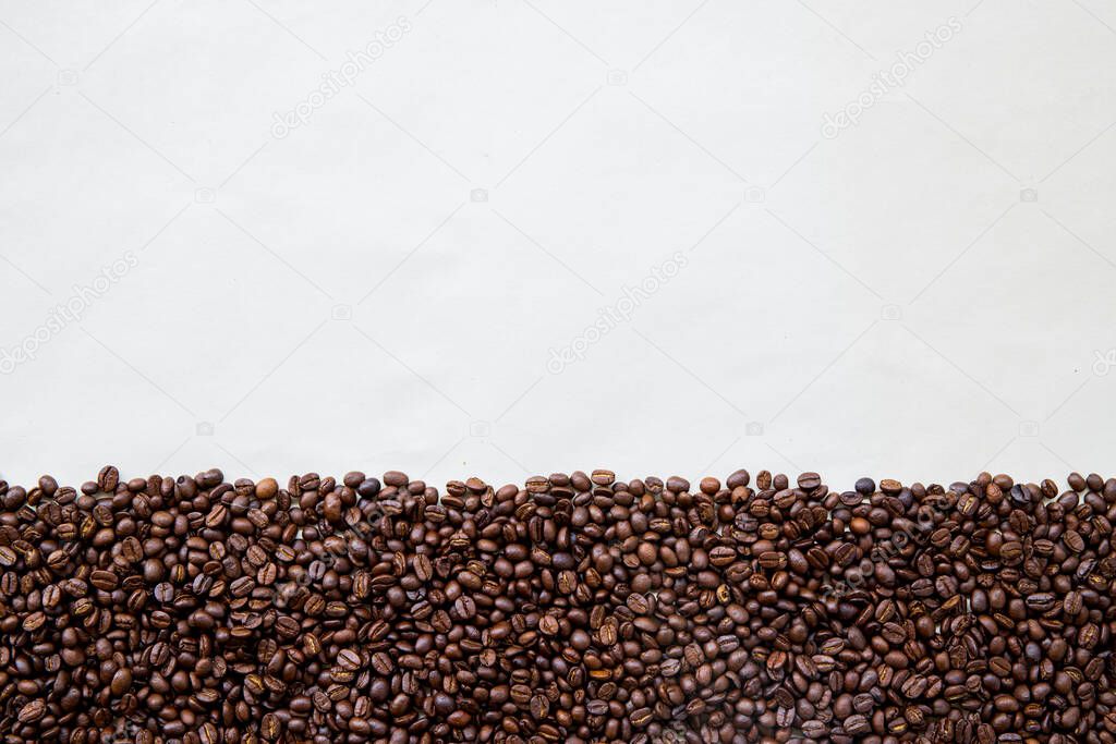 coffee beans on white paper background. mockup and templates to create greeting, cards, magazines, cover, poster and banners etc. space for text. top view. flat lay