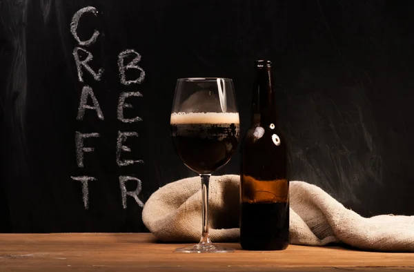 Dark craft beer id the glass — Stock Photo, Image