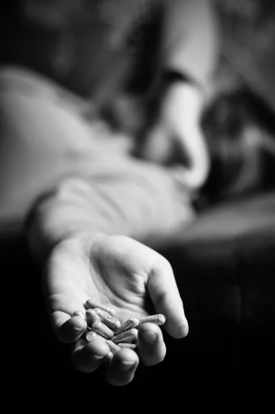 Sad young girl holds in her hand a tablet — Stock Photo, Image