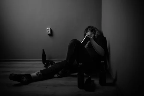 Sad woman drinking alcohol, black and white — Stock Photo, Image