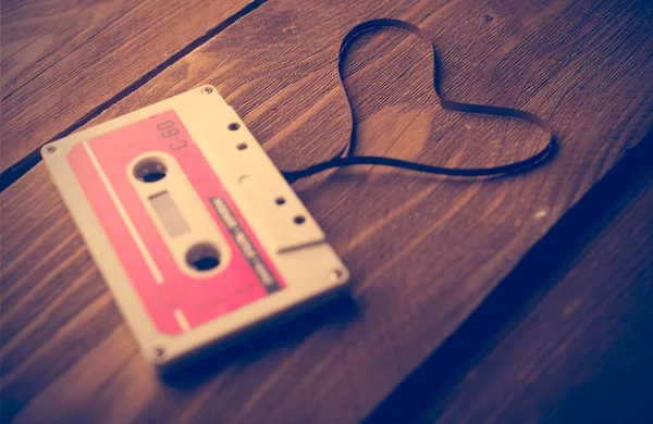 Audio cassette tape in the shape of heart. Retouching vintage. Royalty Free Stock Photos