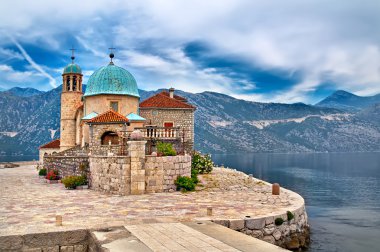 Island on the lake in Montenegro clipart