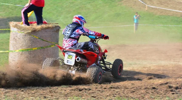 Unidentified racer rides a quad motorbike. — Stock Photo, Image