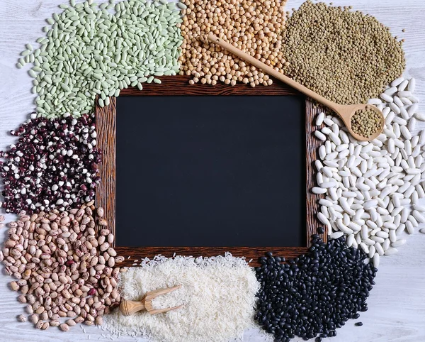 Legumes with blackboard. — Stock Photo, Image