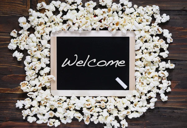Popcorn e parola benvenuto . — Foto Stock