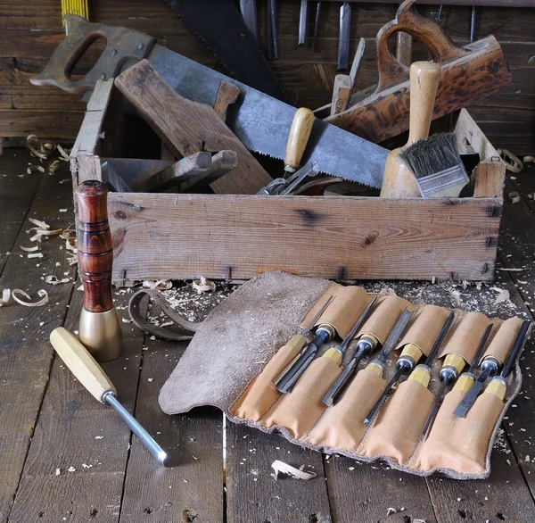 Different tools on wooden floor — Stock Photo, Image