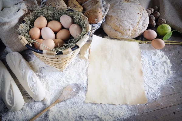 Rustic ingredients for bread on wooden table — Stock Photo, Image