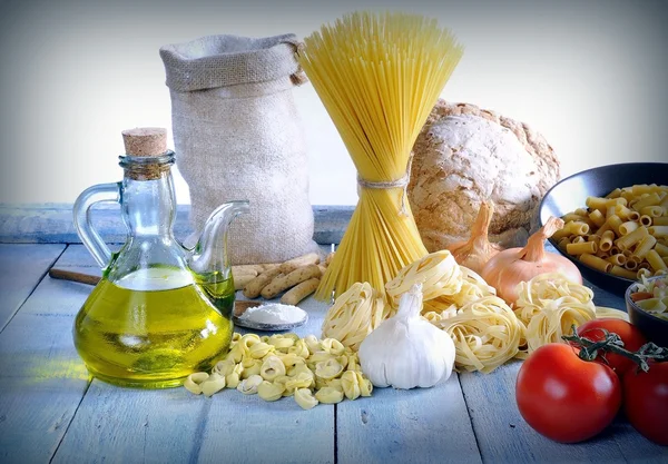 Still life of raw ingredients on blue wooden floor — Stok fotoğraf