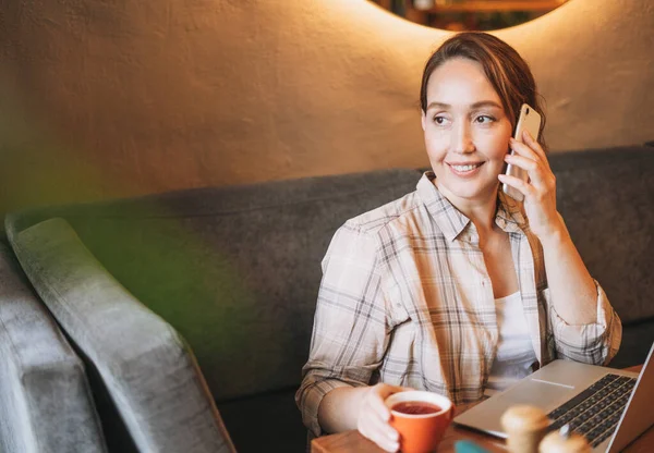 Adult Charming Brunette Woman Plaid Shirt Working Laptop Using Mobile — Stock Photo, Image