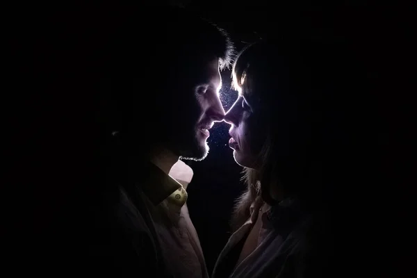 Couple Lovers Kiss Night Light Black Background Rays Visible Passing — Stock Photo, Image