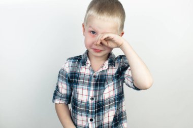 An ophthalmologist examines a boy who complains of burning and pain in his eyes. Eye fatigue from a computer or phone screen (sensation of sand on the cornea). Diagnosis of conjunctivitis in children. clipart
