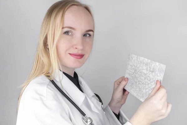 A neurologist examines an encephalogram of a patients brain. Schedule of electroencephalograms study of brain currents for signs of epilepsy and pathologies of the nervous system