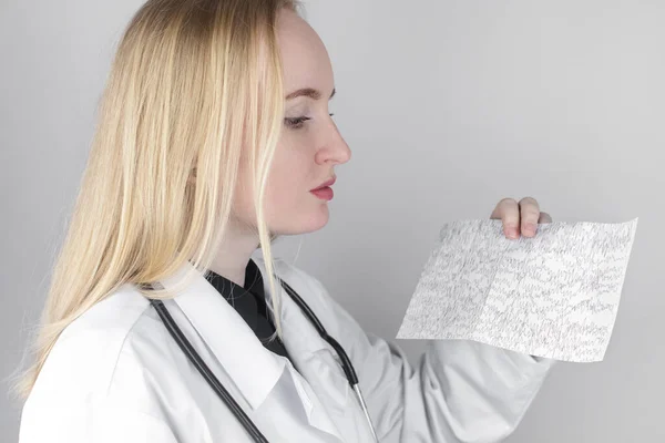 A neurologist examines an encephalogram of a patients brain. Schedule of electroencephalograms study of brain currents for signs of epilepsy and pathologies of the nervous system