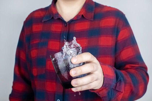 A patient with Parkinson's disease has trembling hands. Tremor of the extremities in various diseases. Close-up of a shivering man. Various objects tremble in hands. Neurological diseases