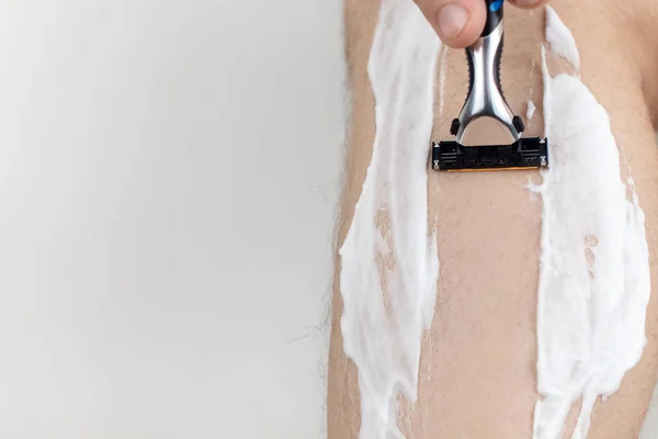 Man White Background Shaves His Legs Hairy Legs Care Them — Stock Photo, Image