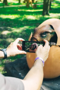 Kentrosaurus in a natural environment. Dinosaur with a beak and spines on its back. Robotics and animatronics. Reconstruction of extinct animals from the prehistoric period