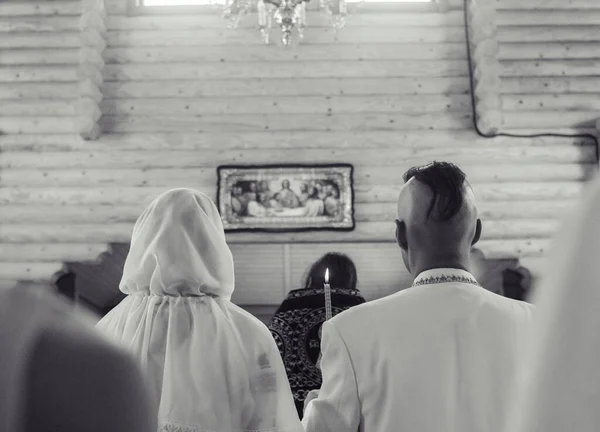 Young people dressed in vintage outfits to get married in the church. Reconstruction of Cossack customs in Ukraine. Old Slavic customs and traditional historical costumes. Stylized wedding