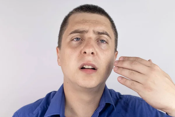 A man with sweating on his face is looking at the camera. Sweat gland problems. Hyperhidrosis, increased sweating, anhidrosis. The concept of treatment for violations of the mechanisms of secretion.