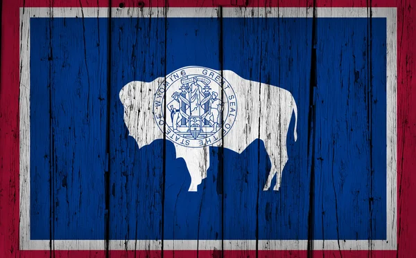 Wyoming vlag Grunge houten achtergrond — Stockfoto