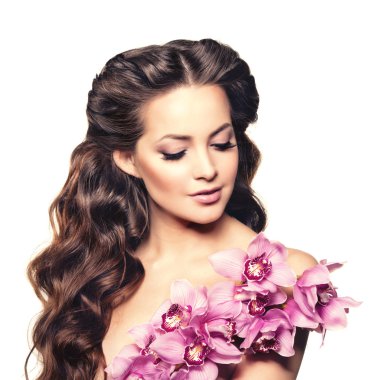 Beauty young woman, luxury long curly hair with orchid flower. H