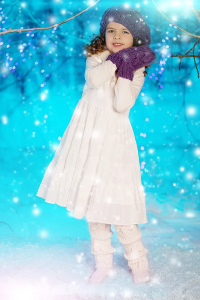 Christmas child girl on winter tree background, snow, snowflakes — Stock Photo, Image