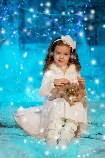 Christmas child girl on winter tree background, snow, snowflakes Royalty Free Stock Photos