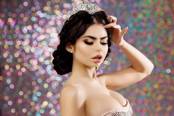 Woman in lux dress crown, queen princess lights party background — Stockfoto
