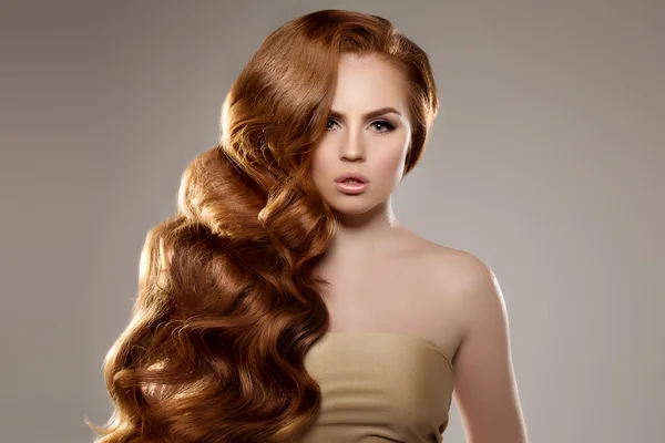 Model with long red hair. Waves Curls Hairstyle. Hair Salon. Upd Stock Kép