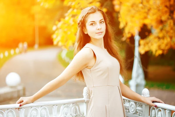 Autumn woman. Beautiful young trendy girl in autumn park Royalty Free Stock Images
