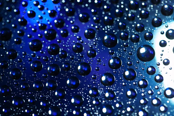 Texture de fond abstraite gouttes d'eau et lumière d'art sur glas — Photo