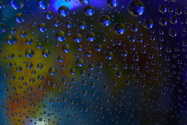 Textura de fondo abstracto gotas de agua y luz de arte en vidrio — Foto de Stock