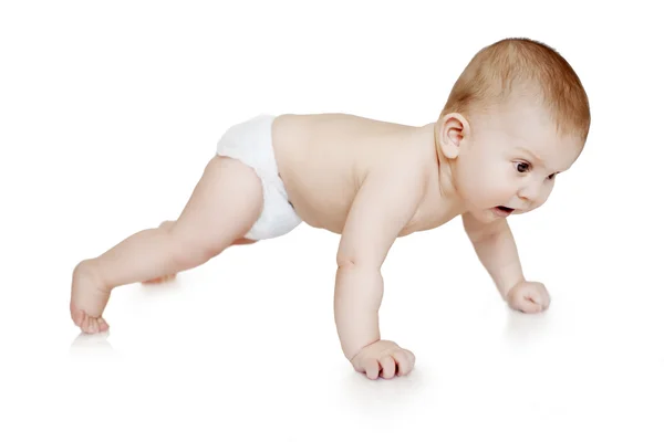 Baby sports. Child making push ups. Kid is engaged in fitness on — Stockfoto