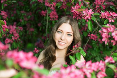Young spring fashion woman in spring garden Springtime Summertim