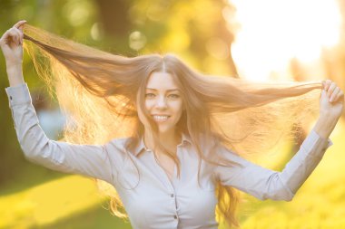 Romantic young girl outdoors enjoying nature Beautiful Model in 