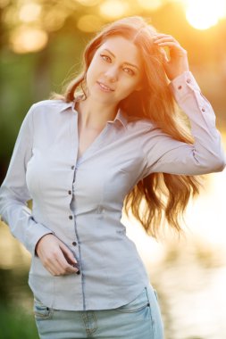 Romantic young girl outdoors enjoying nature Beautiful Model in 