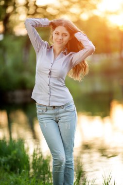 Romantic young girl outdoors enjoying nature Beautiful Model in 